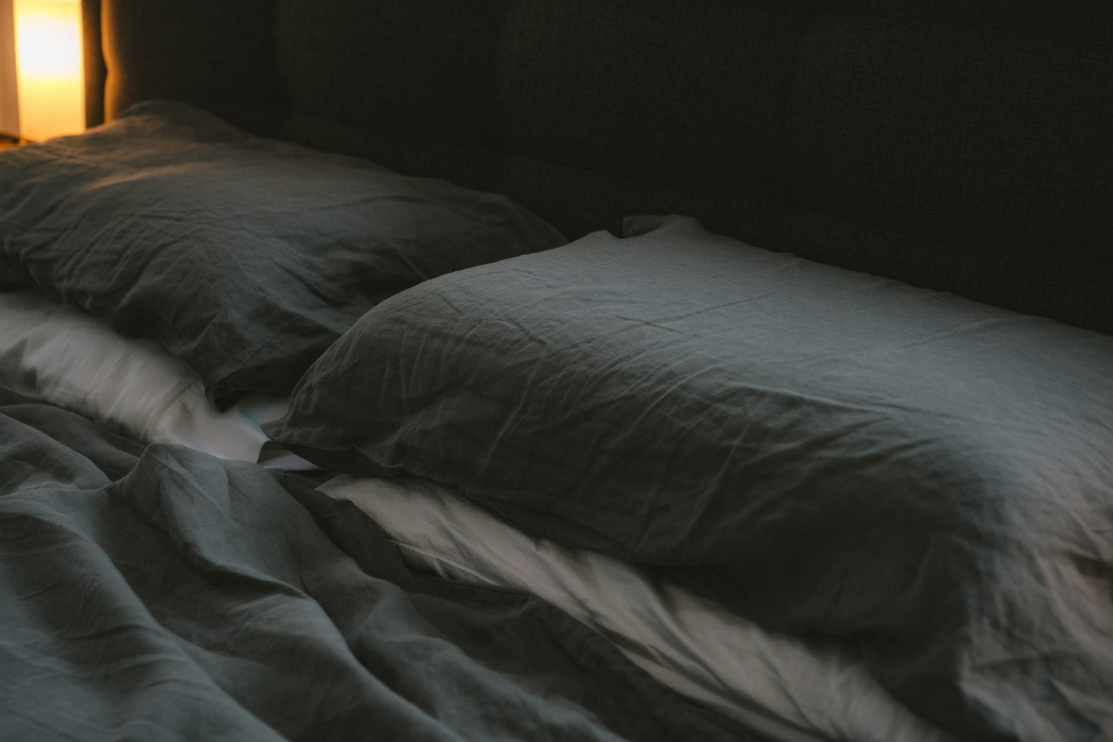 Soft white pillow on bed