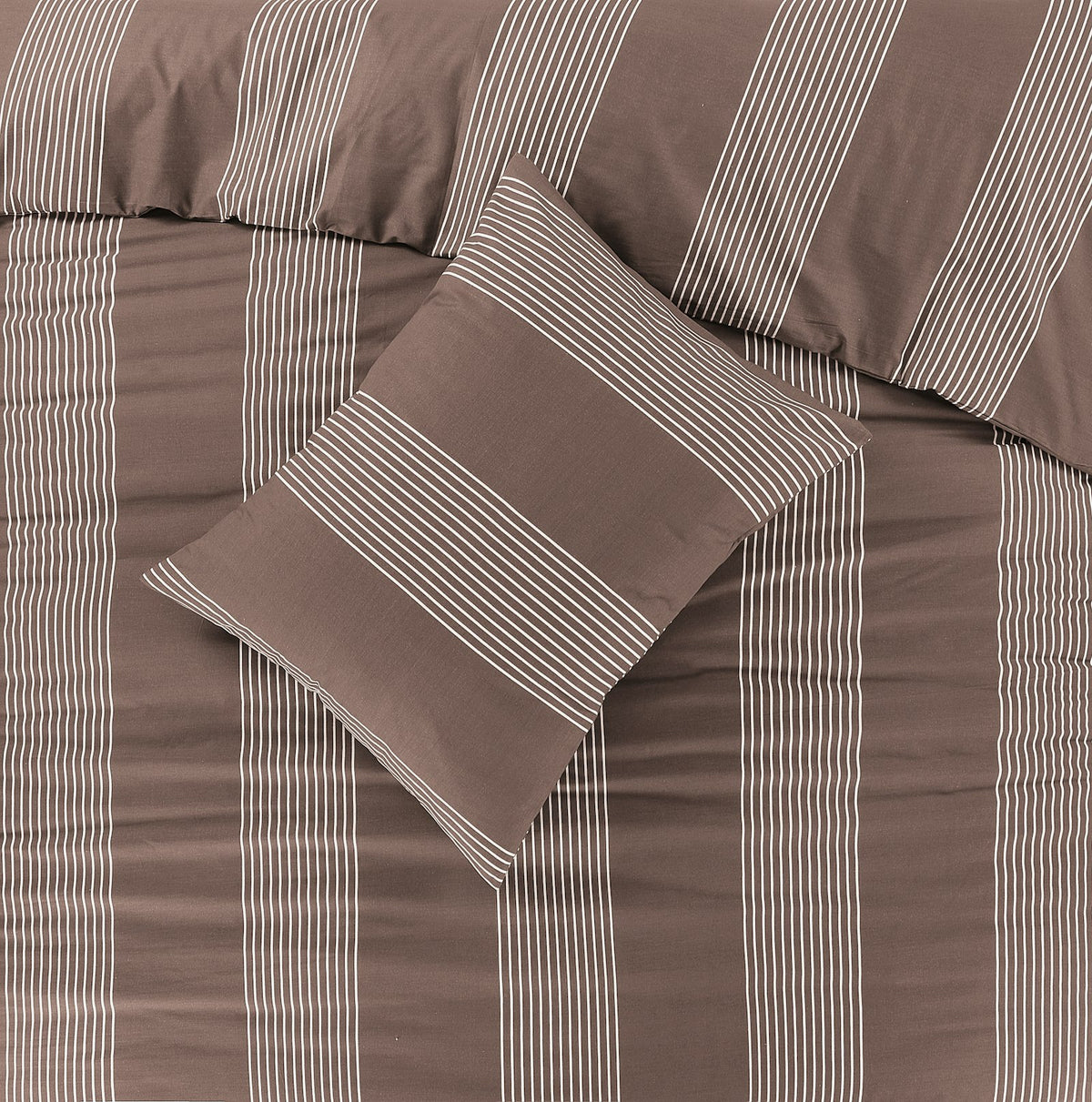 Bed with brown and white striped duvet cover