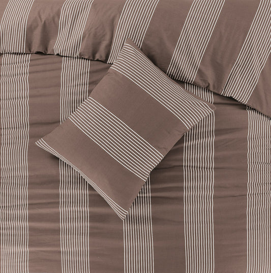 Bed with brown and white striped duvet cover